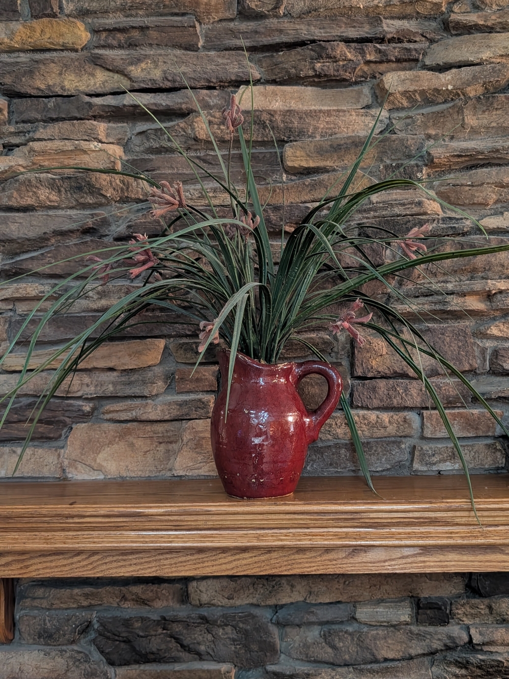 Vintage Oxblood Red Ceramic Pitcher Vase with Faux Grass